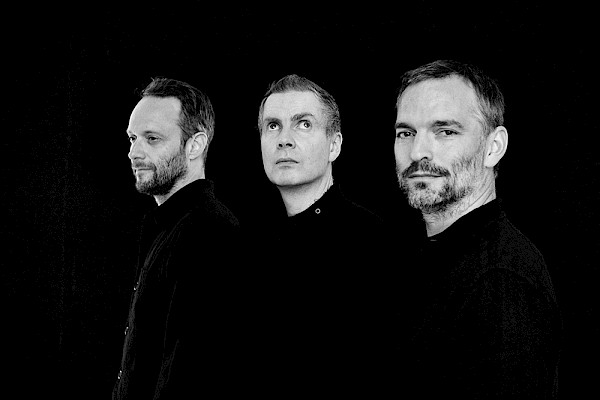 The trio of Sigur Rós—Georg Hólm, Jónsi and Kjartan Sveinsson—are joined by 40-plus member local orchestras led by conductor Robert Ames on the final North American leg of their orchestral world tour this November: Photo by Chloé Kritharas